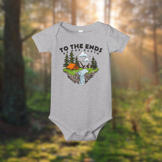 Gray baby onesie with an adventure graphic featuring tents, trees, and a waterfall, ideal for little explorers.
