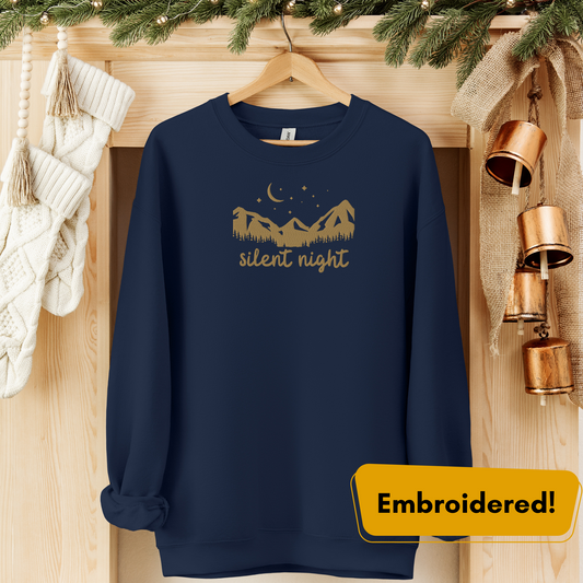 Silent Night Embroidered Crewneck in navy blue featuring gold mountains and stars, perfect for cozy evenings.