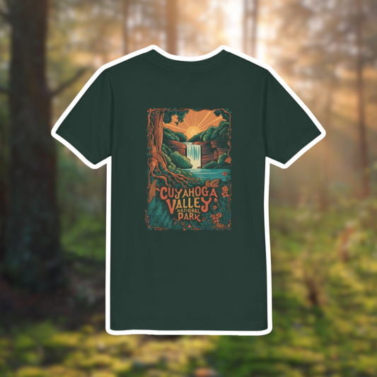 Cuyahoga Valley National Park youth tee featuring a vibrant waterfall and sunrise graphic on a green shirt.