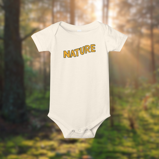 Nature Baby Onesie in soft cotton with bold 'NATURE' lettering, set against a sunlit forest background.