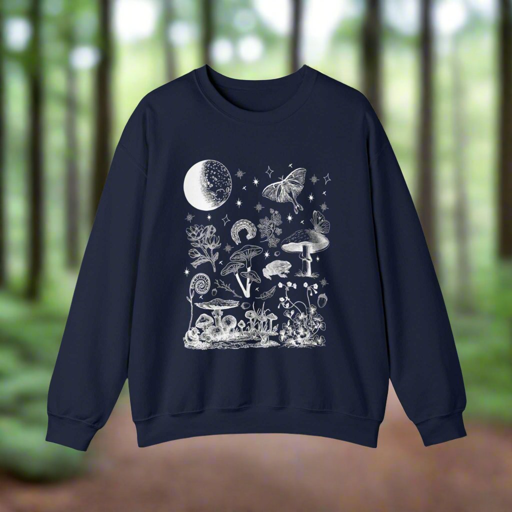 Mushroom Forest SweatshirtBring the beauty and magic of the forest at night into your fall and winter outfit rotation with this mushroom forest sweatshirt. Whether you're going for a forestco