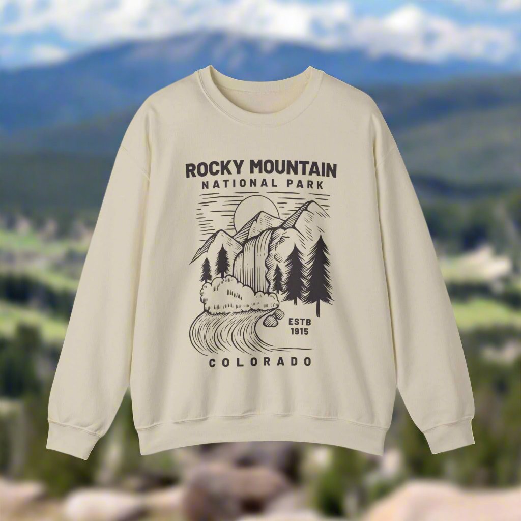 Rocky Mountain National Park SweatshirtBring the beauty of Rocky Mountain National Park of Colorado into your wardrobe with this simple waterfall and mountain landscape cozy and comfy crewneck sweatshirt