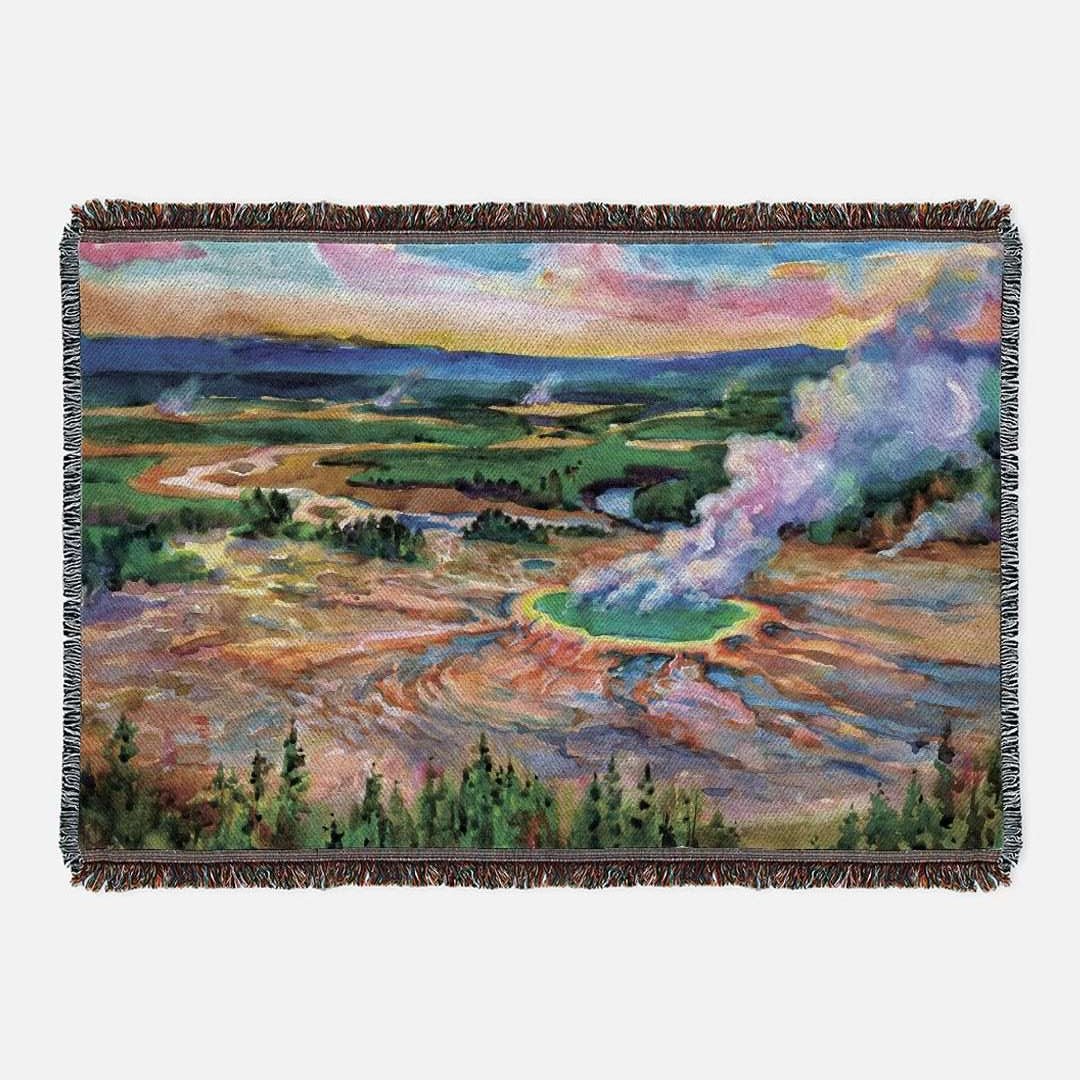 Yellowstone National Park Woven BlanketCozy up and remember all your favorite memories from your Yellowstone National Park adventures with this soft woven blanket featuring an original artist watercolor p