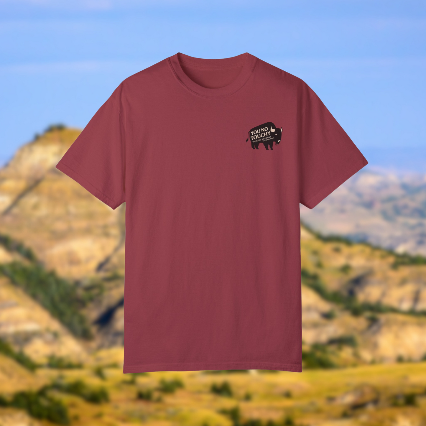 Maroon Theodore Roosevelt National Park shirt featuring a bison design with a cheeky reminder to respect wildlife.