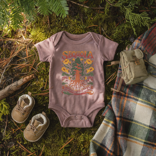 Sequoia National Park baby onesie in soft cotton with nature-themed design, surrounded by woodland elements.