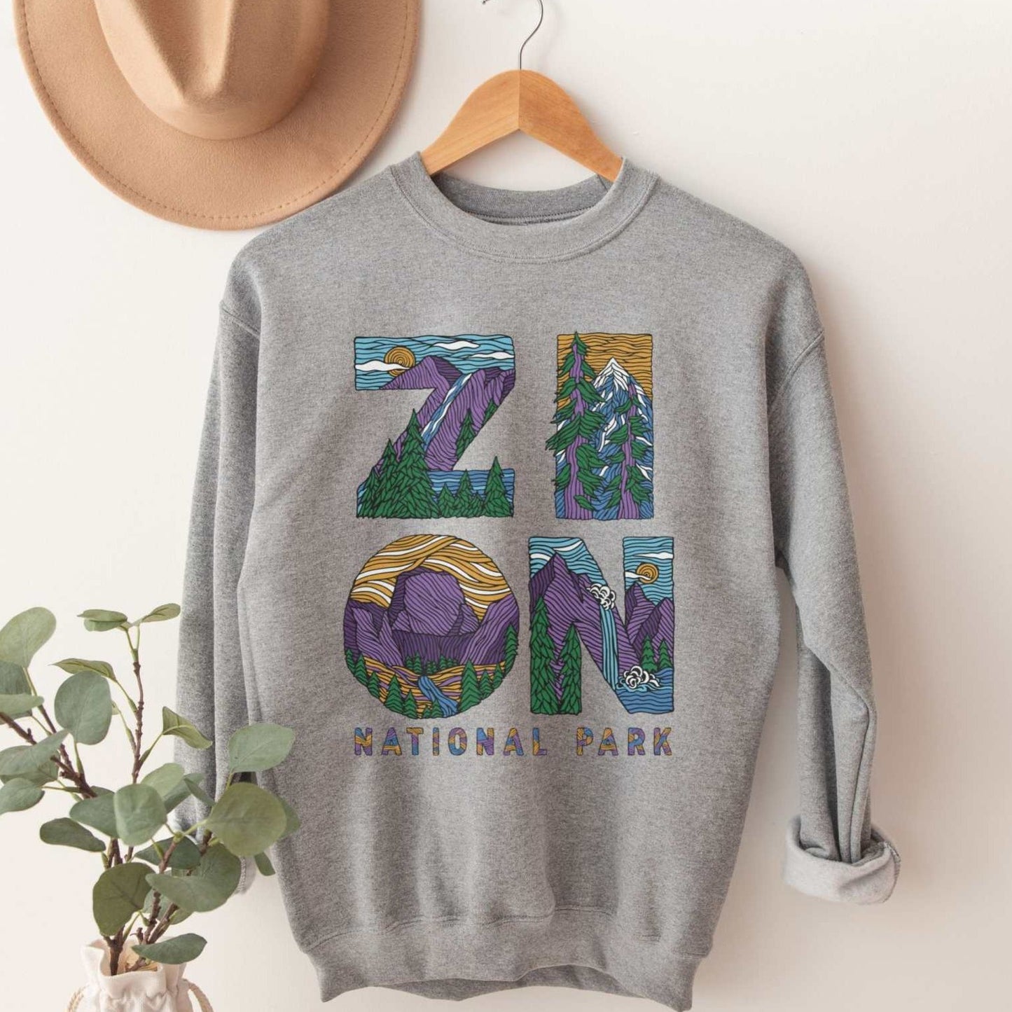 Zion Letters National Park SweatshirtBring back the vibe on your next outdoor outing with this adventure filled Zion National Park Sweatshirt.
- cotton blend - medium weight - unisex sizing
The Lincol
