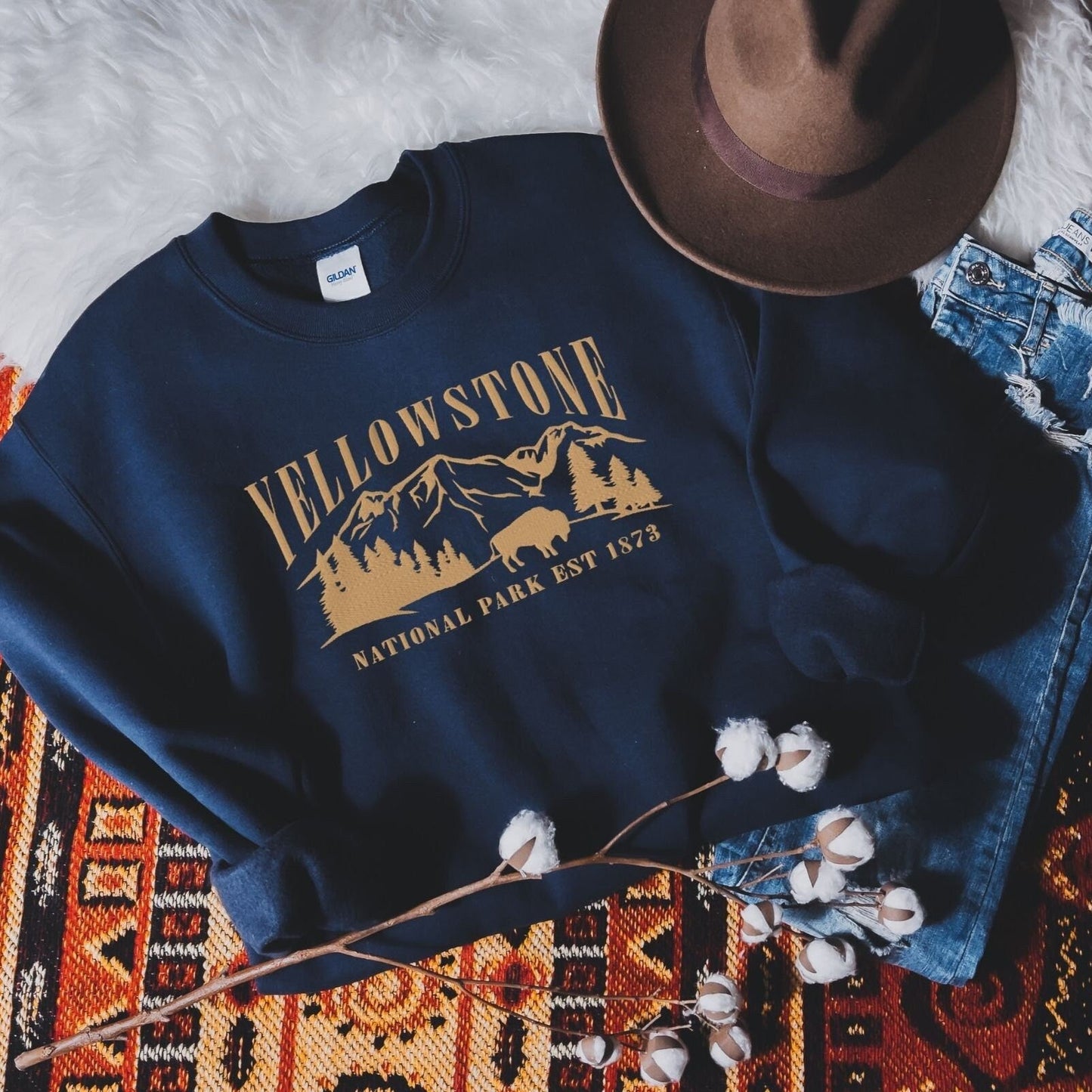 Yellowstone National Park Embroidered Crewneck SweatshirtBring the majesty of Yellowstone National Park into your wardrobe with this embroidered boyfriend crewneck sweatshirt inspired by the iconic Rocky Mountains and wild