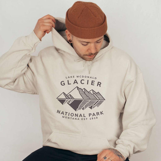 Glacier Lake McDonald National Park SweatshirtBring the beauty of Lake McDonald in Glacier National Park in the Rocky Mountains of Montana into your wardrobe with this ultrasoft and lightweight jersey cotton t-s