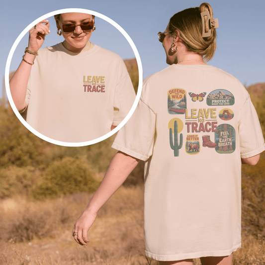 Woman wearing Leave No Trace tee with vintage graphics in outdoor setting, promoting adventure and environmental stewardship.