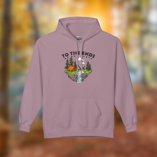 "Ends of the Earth Hoodie in soft pastel pink, featuring a nature-inspired graphic with mountains, trees, and a tent."