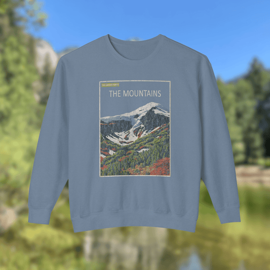 The Mountains Crewneck - Nature Library Series featuring a vintage graphic of alpine peaks and a retro design.
