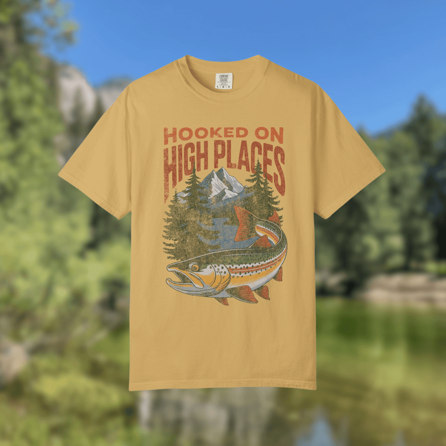 Trout adventure tee shirt featuring vintage design with mountains and trees, ideal for outdoor enthusiasts.