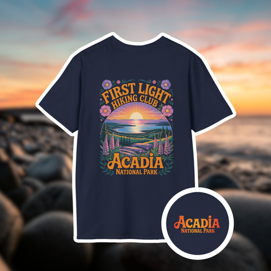 First Light Acadia National Park shirt featuring sunrise design and hiking club logo, ideal for outdoor enthusiasts.