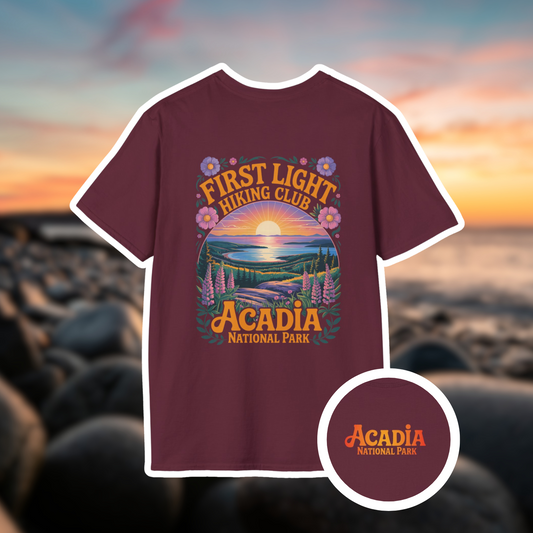 First Light Acadia National Park shirt featuring a hand-drawn sunrise design and floral elements.