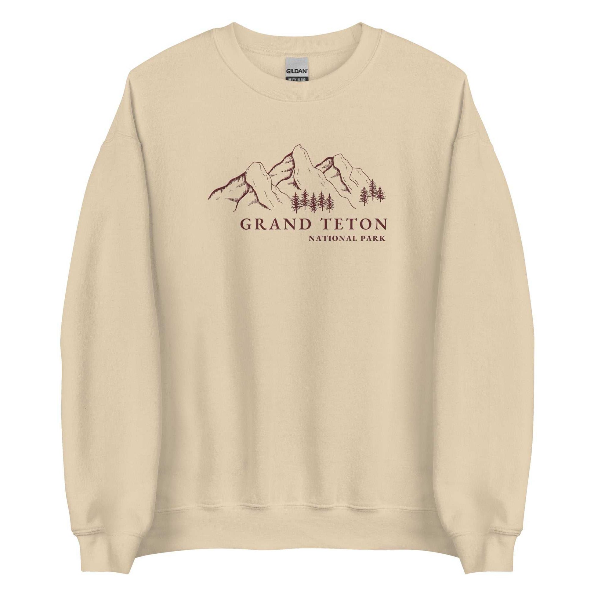 Grand Teton National Park Embroidered Crewneck SweaterBring the majesty of Grand Teton National Park into your wardrobe with this embroidered boyfriend crewneck sweater inspired by the iconic Rocky Mountains that drew y