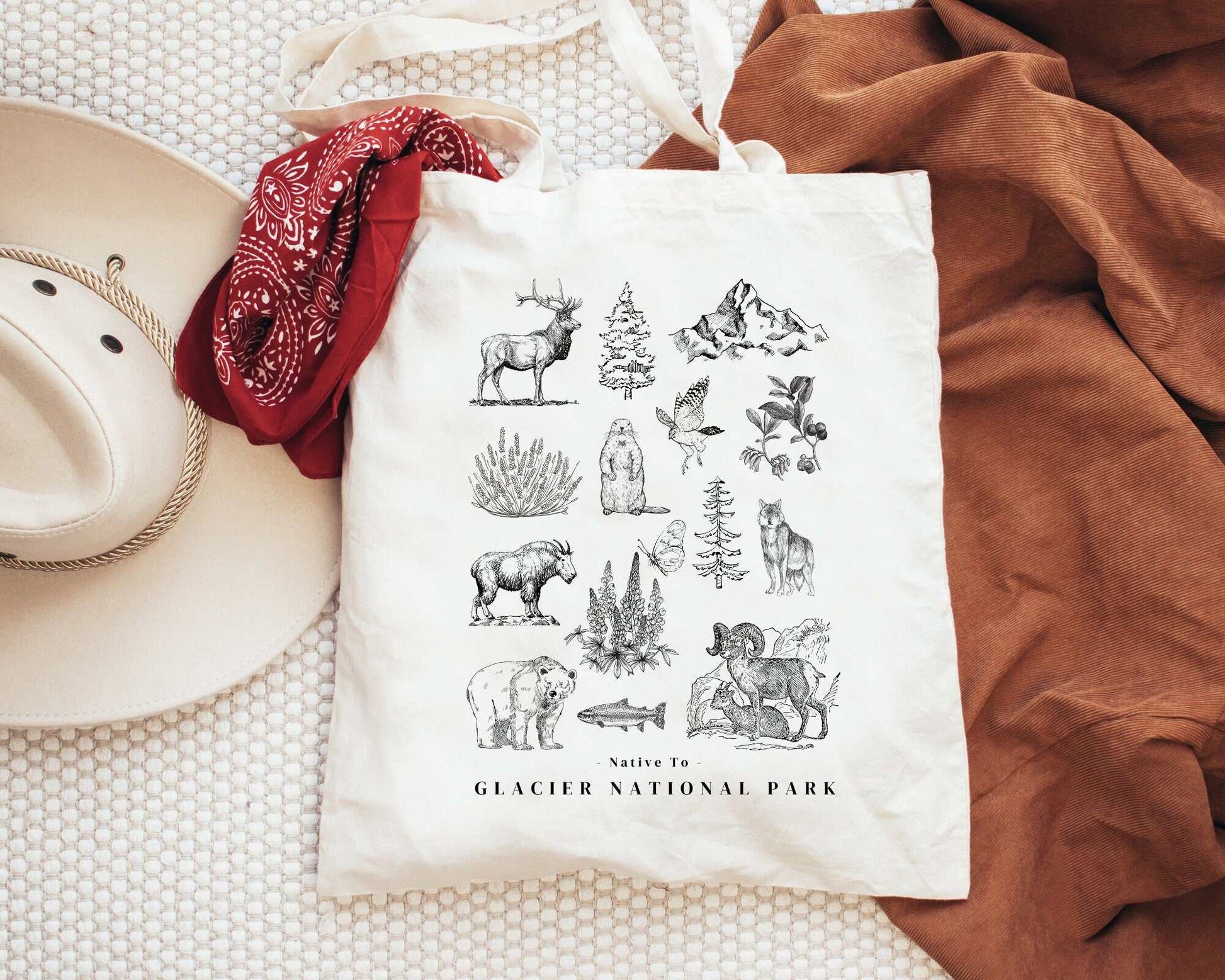 Glacier National Park ToteThese organic cotton tote bags feature the iconic flora and fauna of Glacier National Park in the state of Montana.
Details:
- 15.75"h x 15.25"w - handle length of 2